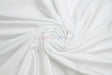 White nylon spandex 4 way stretch fabric from mytextilefabric swirled into a spiral pattern.