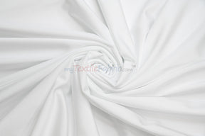 White nylon spandex 4 way stretch fabric from mytextilefabric swirled into a spiral pattern.