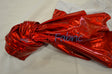 Red metallic foil spandex twisted in a knot with a white backing peeking through