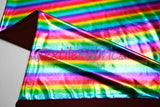 Rainbow Metallic Foil Spandex Lame | Rainbow Stretch Metallic Lame | All Over Multi Color Foil on Stretch Burgundy Knit | 60" Wide