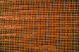 Close-up of orange confetti dot sequins fabric by mytextilefabric