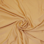 Load image into Gallery viewer, Nylon Spandex 4 Way Stretch Fabric | 60&quot; Width | Great for Swimwear, Dancewear, Waterproof, Tablecloths, Chair Covers | Multiple Colors | Fabric mytextilefabric Yards Light Gold 
