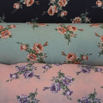 Load and play video in Gallery viewer, Love Flower Rayon Challis Fabric by the Continuous Yard | 60&quot; Wide | Floral Rayon Challis Fabric | Rayon Challis for Dresses and Skirts |
